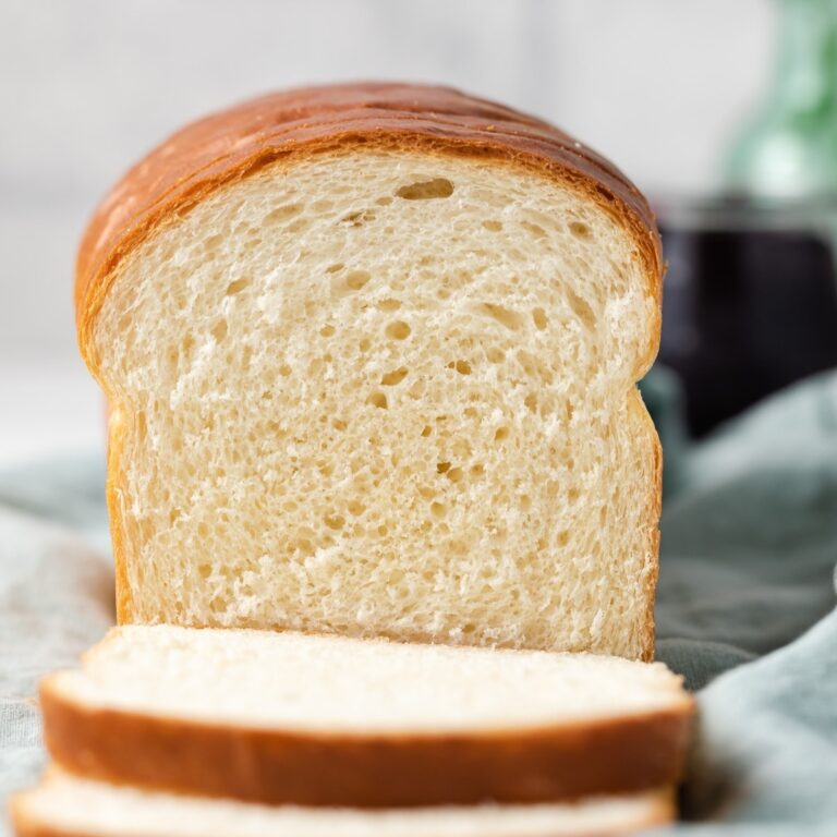 loaf of white bread with two slices cut