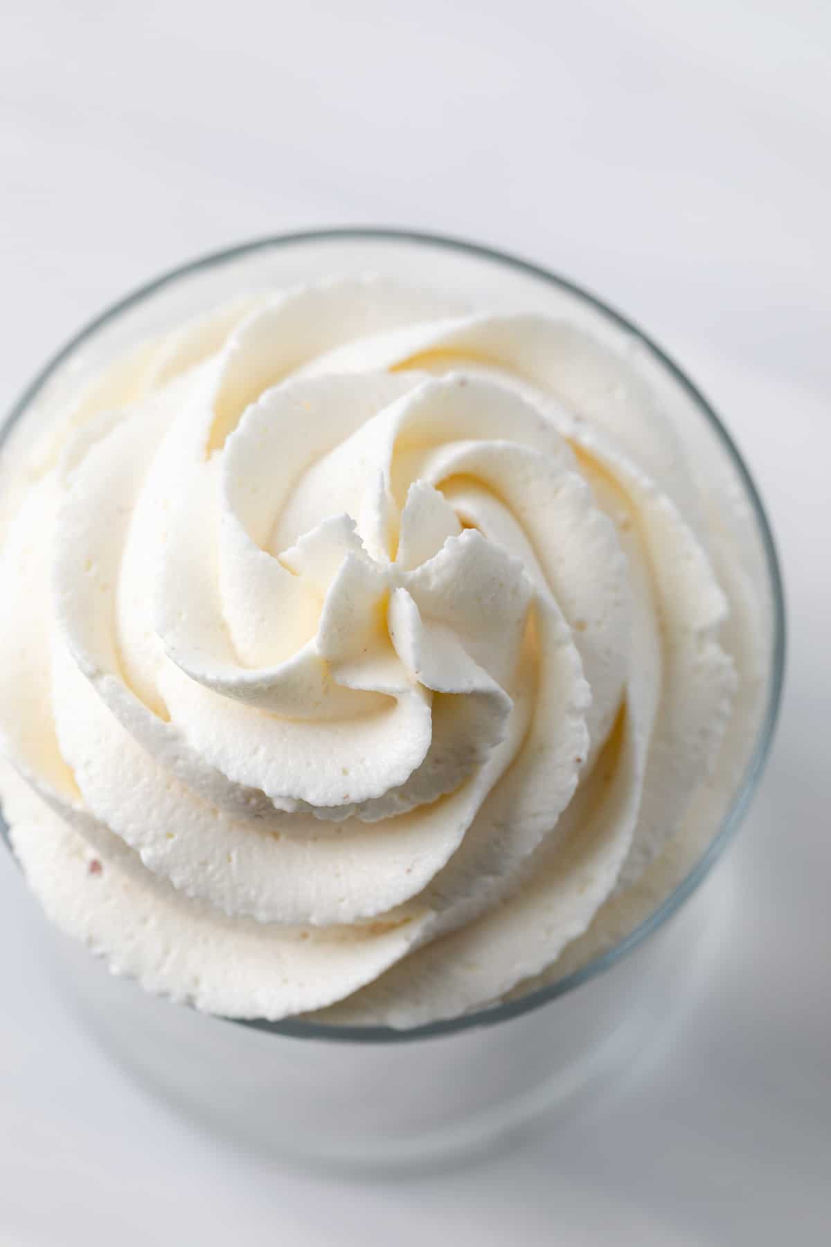 overhead of swirly frosting in a glass