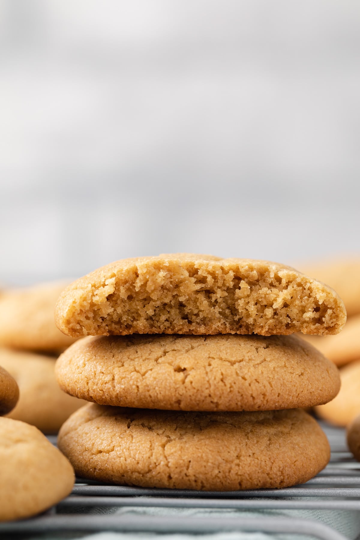 three cookies stacked with the top one bitten so the inside is visible