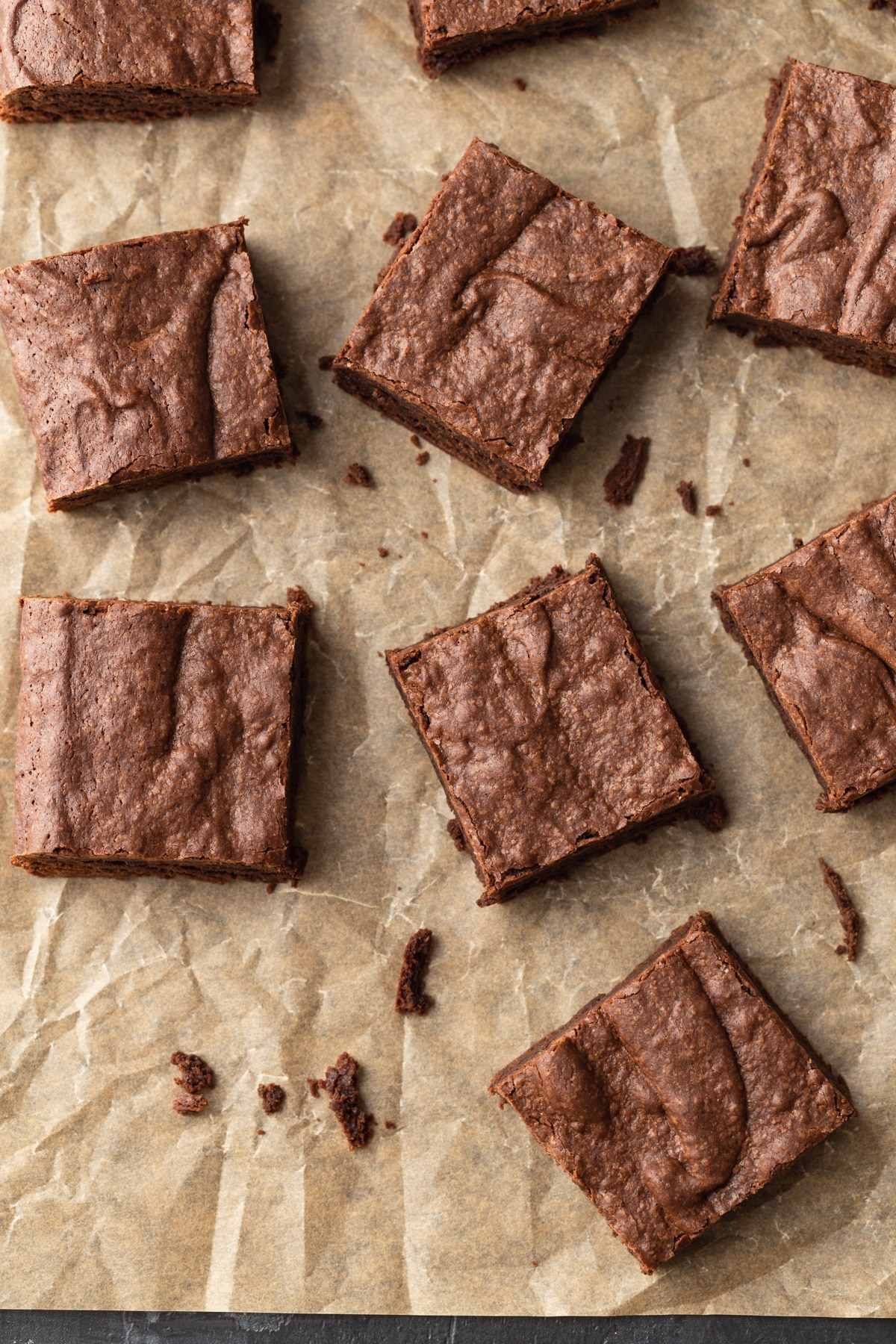 brownies arrange on a piece of brown parchment paper
