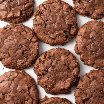 overhead of brownie cookies neatly arranged on white background