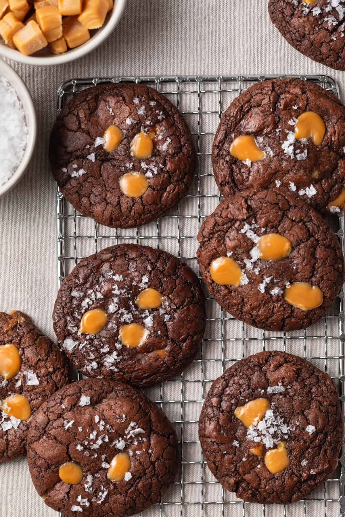 brownie cookies with salted caramel on a wire rack