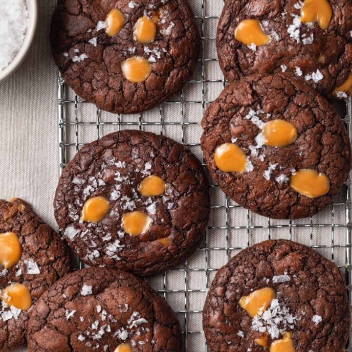brownie cookies with salted caramel on a wire rack