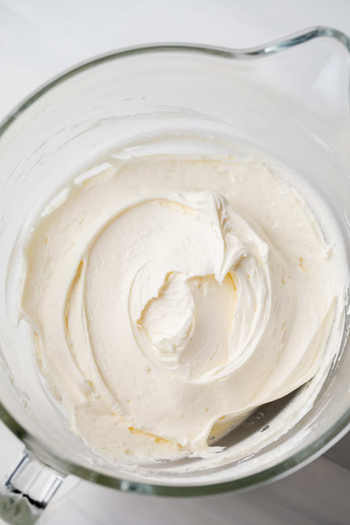 lemon buttercream in a glass mixing bowl