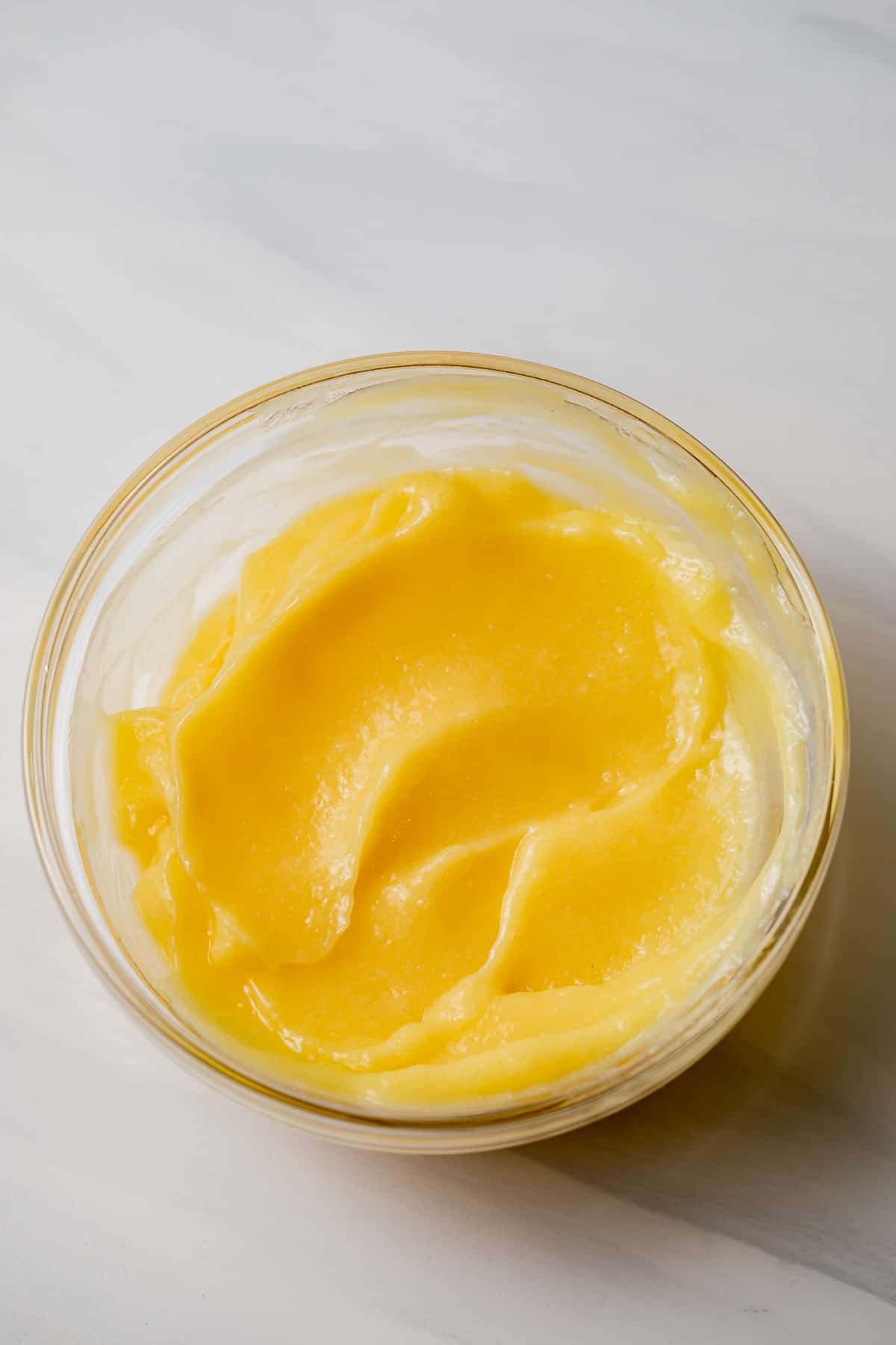 creamy lemon curd in a glass bowl