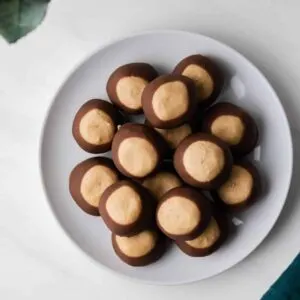 overhead of buckeye candy arranged on a round white plate