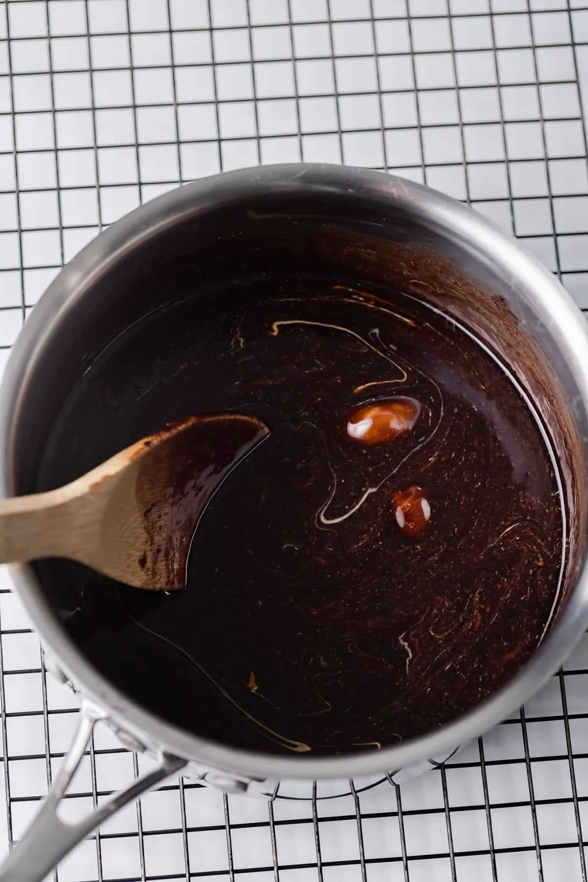 Peanut butter being stirred into no bake cookie base.