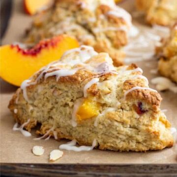 side view of peach scones on a baking sheet