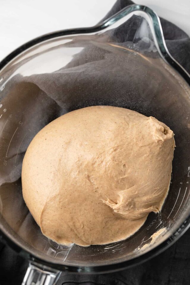 Maple Cinnamon Bagels dough in glass bowl, before rising