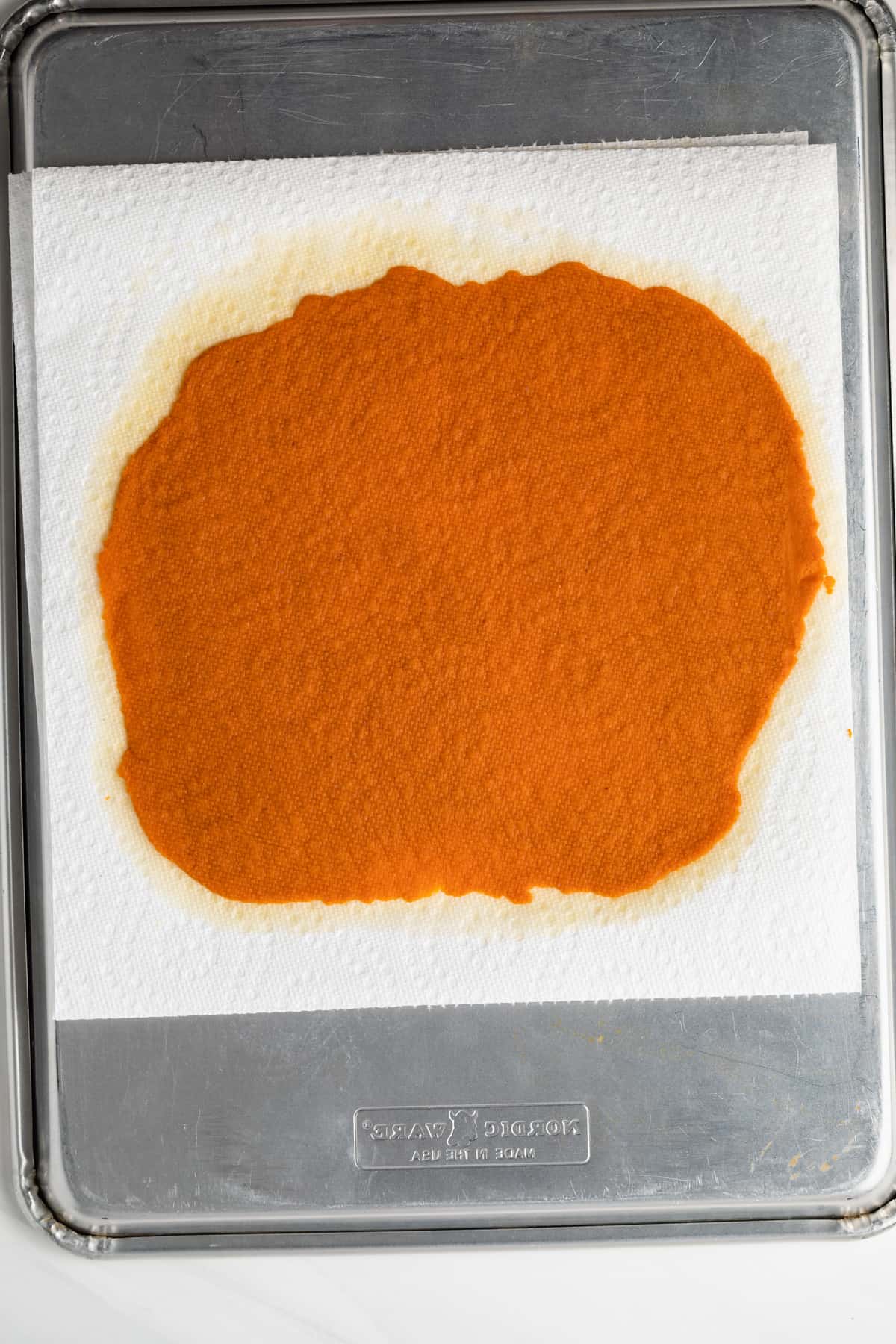Pumpkin puree between two layers of paper towels