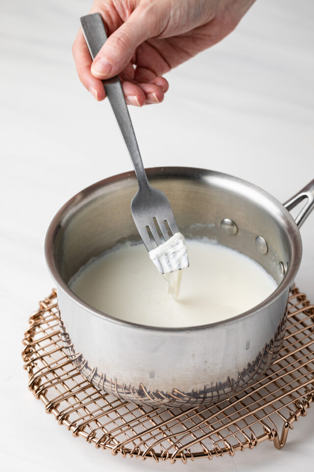 Boiled milk in a saucepan