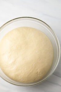Yeast dough that has risen in a measuring bowl