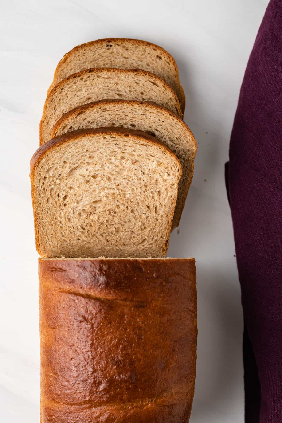 Overhead of sliced whole wheat bread loaf