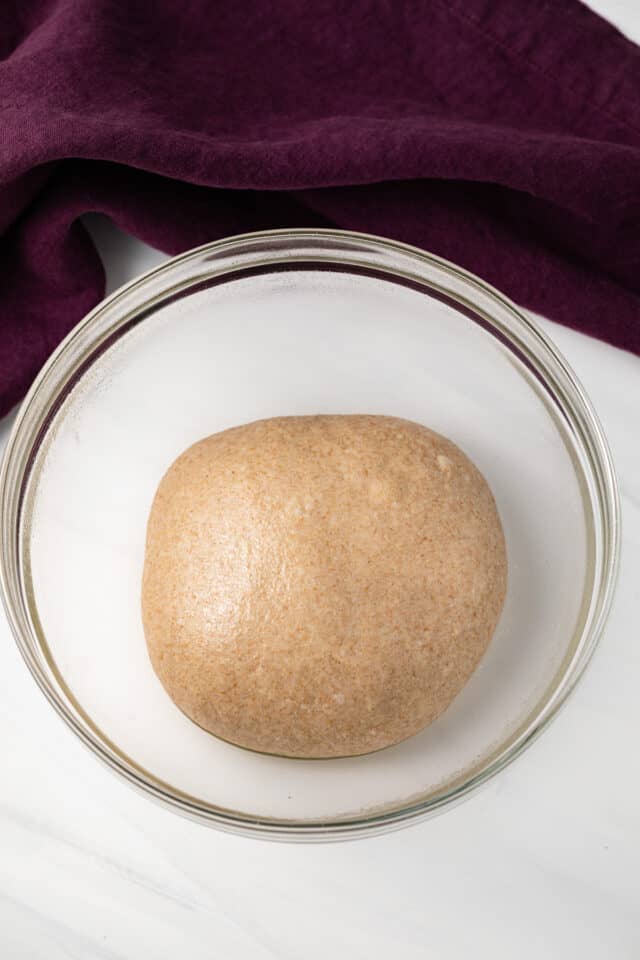 Dough in glass bowl