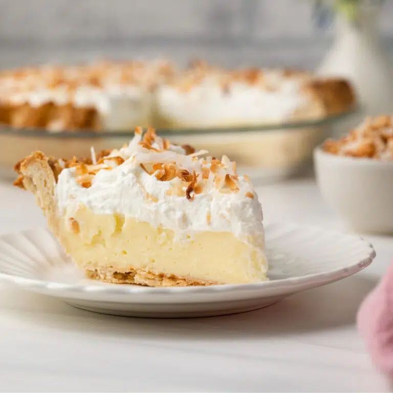 Side view of slice of coconut cream pie.