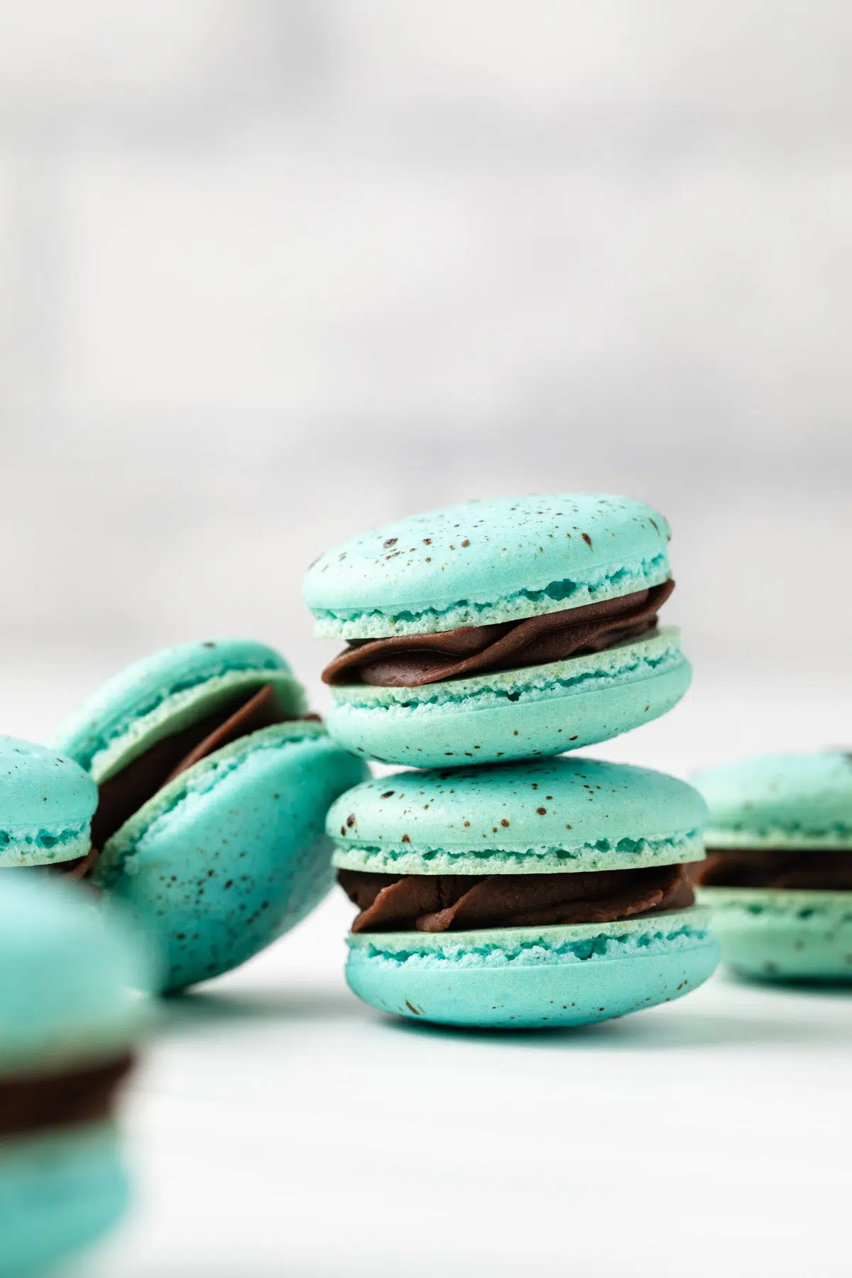 Two easter macarons stacked on one another.