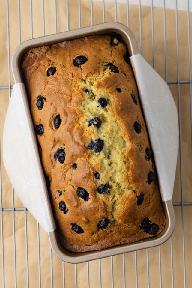 Baked lemon blueberry bread in loaf pan.