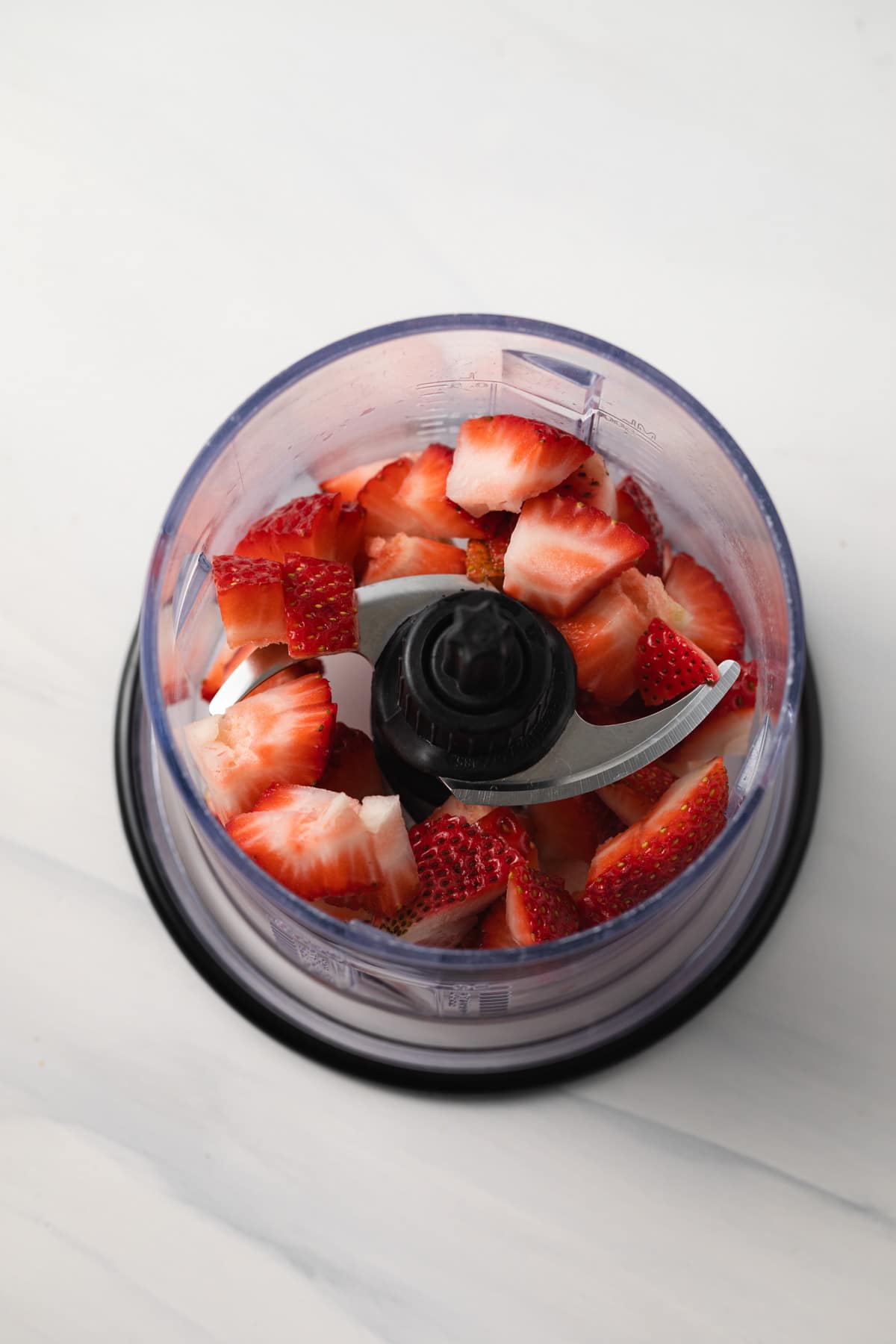 Strawberries in food processor.