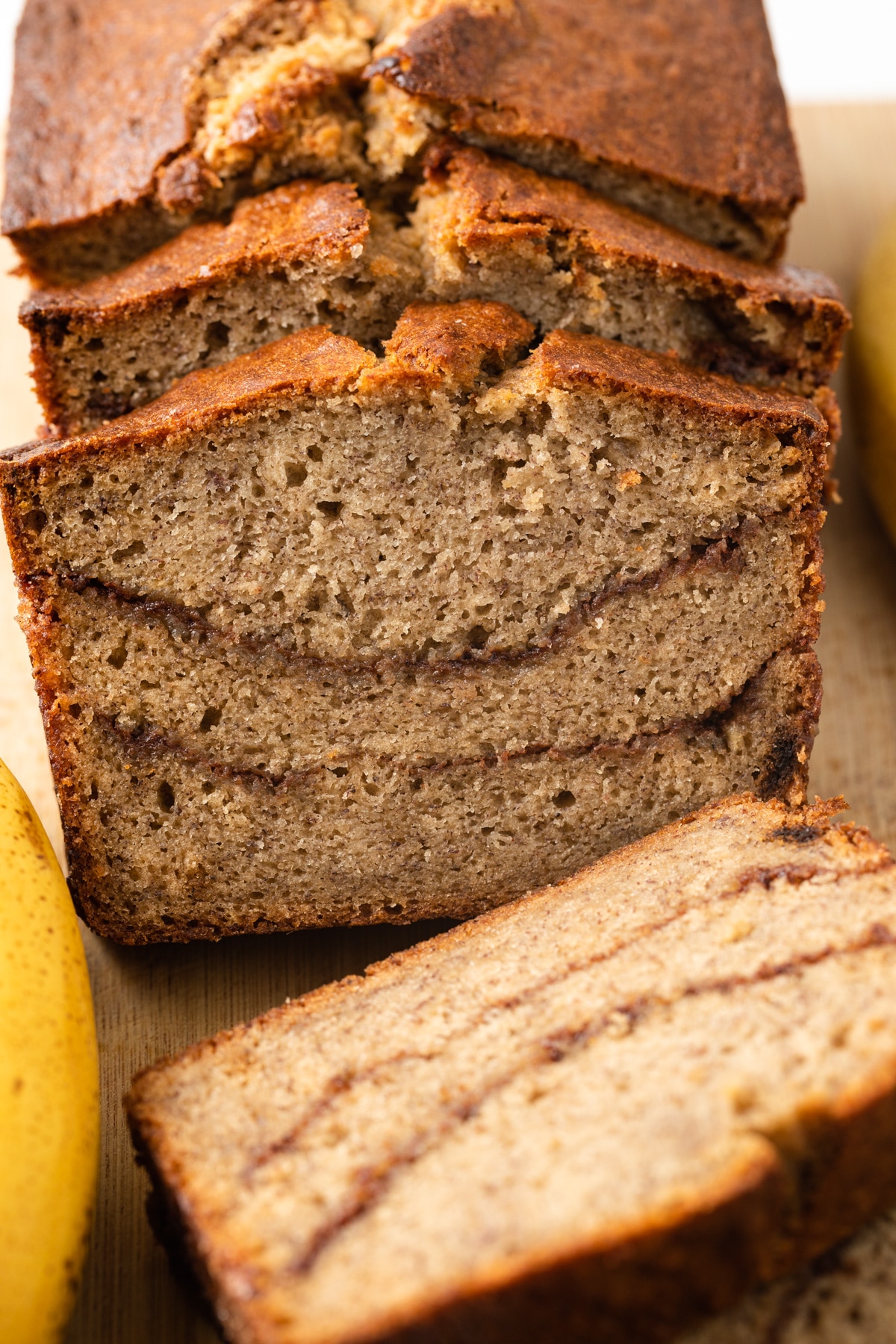 Close up of sliced cinnamon swirl banana bread.