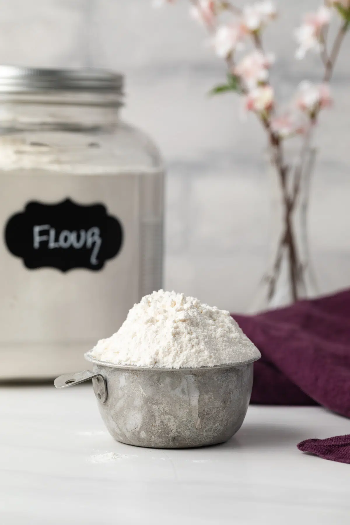 Heat treated flour in a measuring cup.