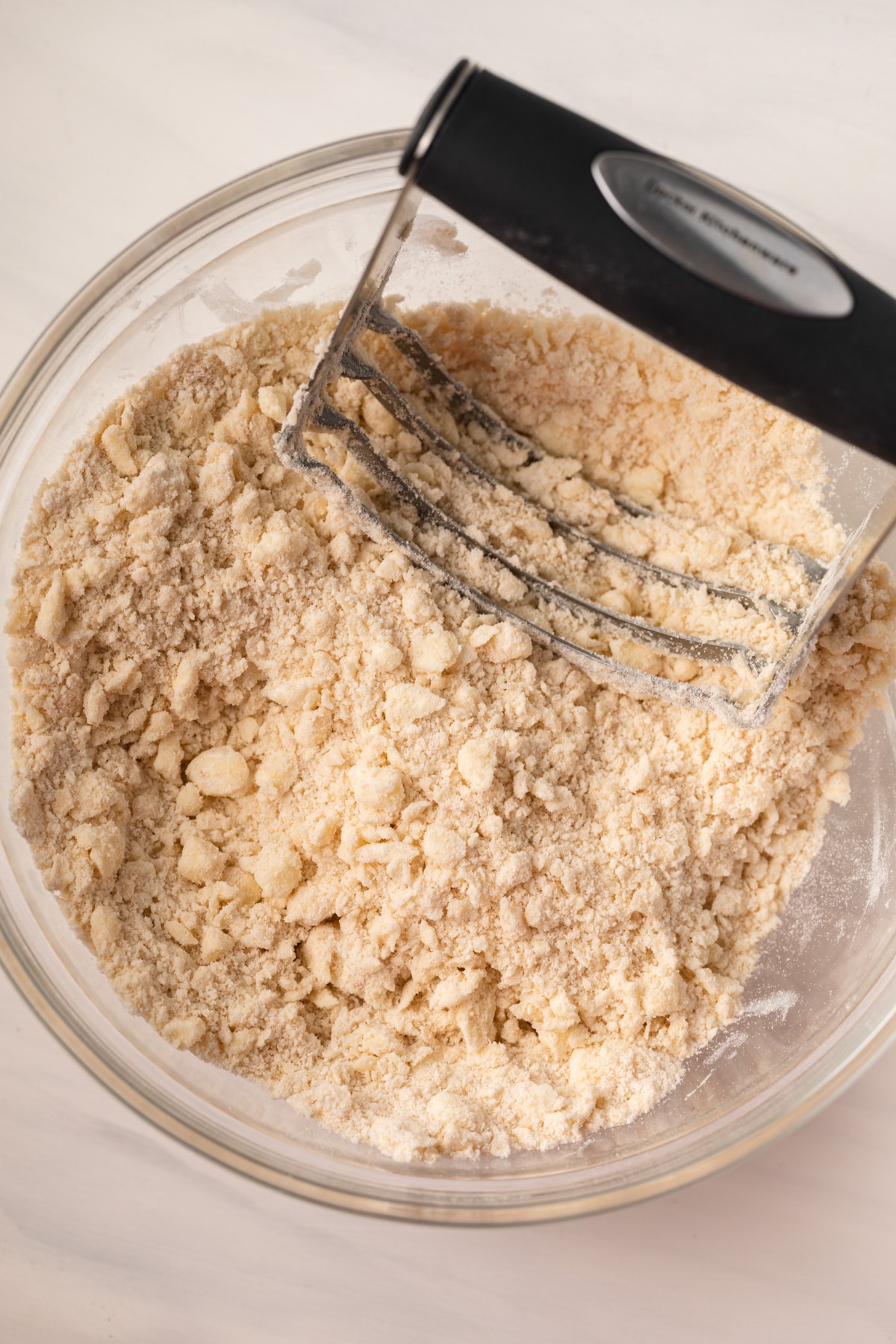 Butter cut into flour with a pastry blender.