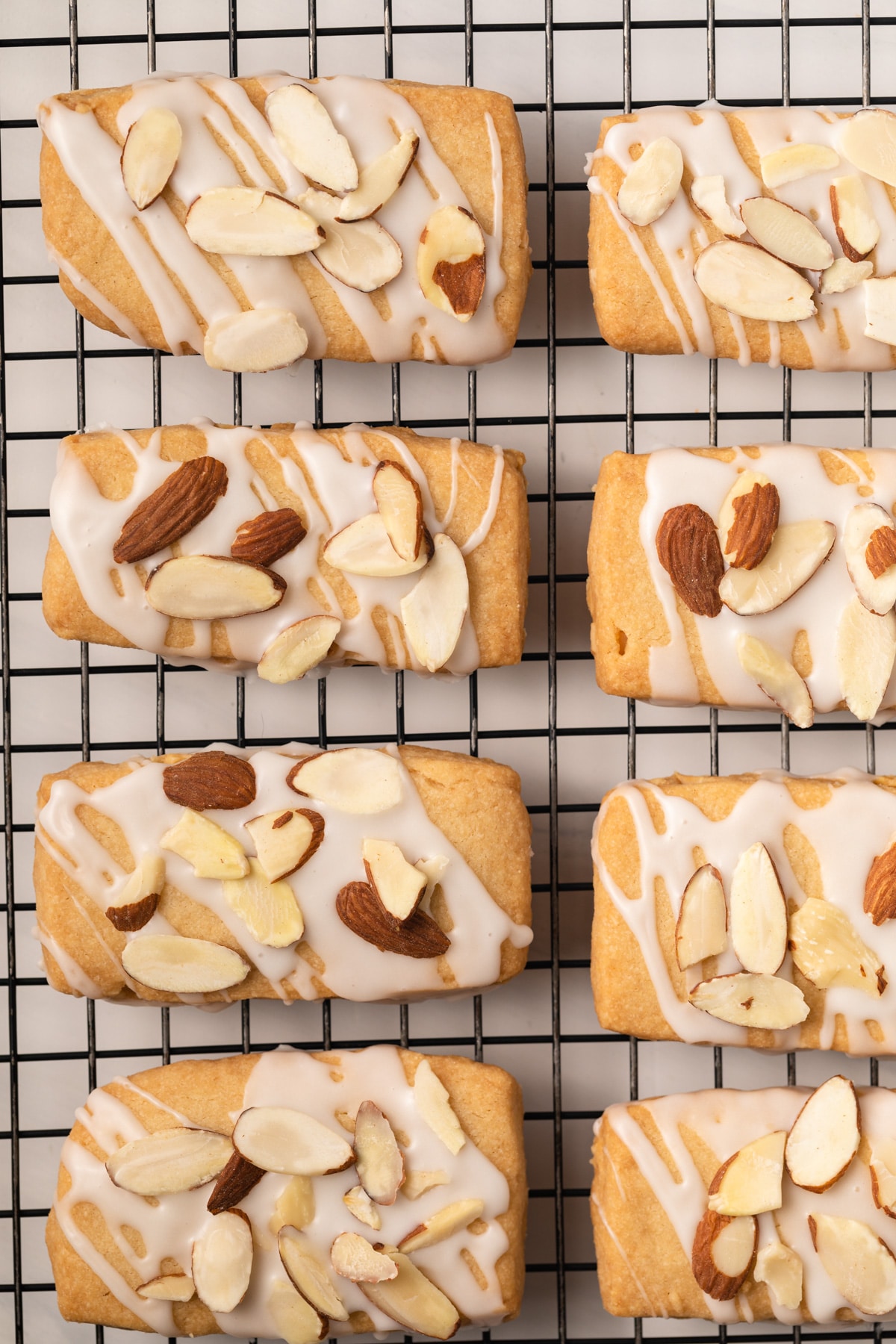 Almond bars on a wire rack.