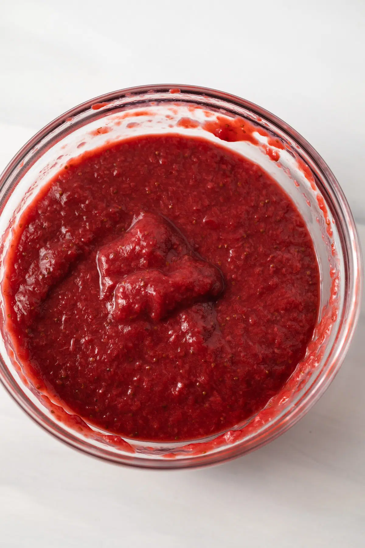 Strawberry reduction in a glass bowl.