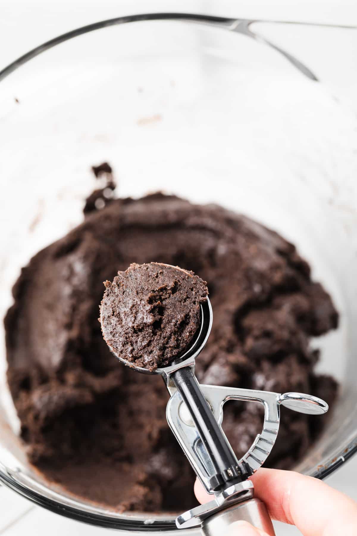 Oreo dough scooped with cookie scoop.