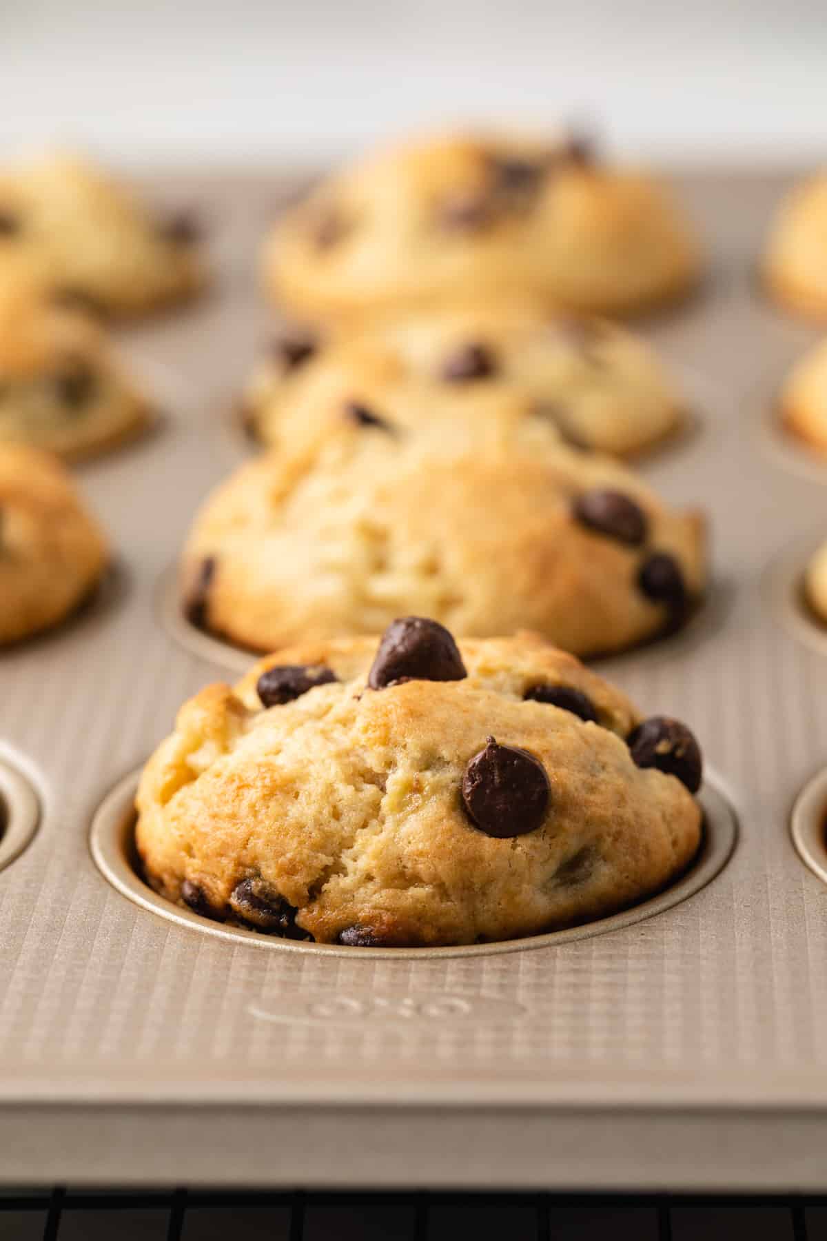 Side view of banana chocolate chip muffins.