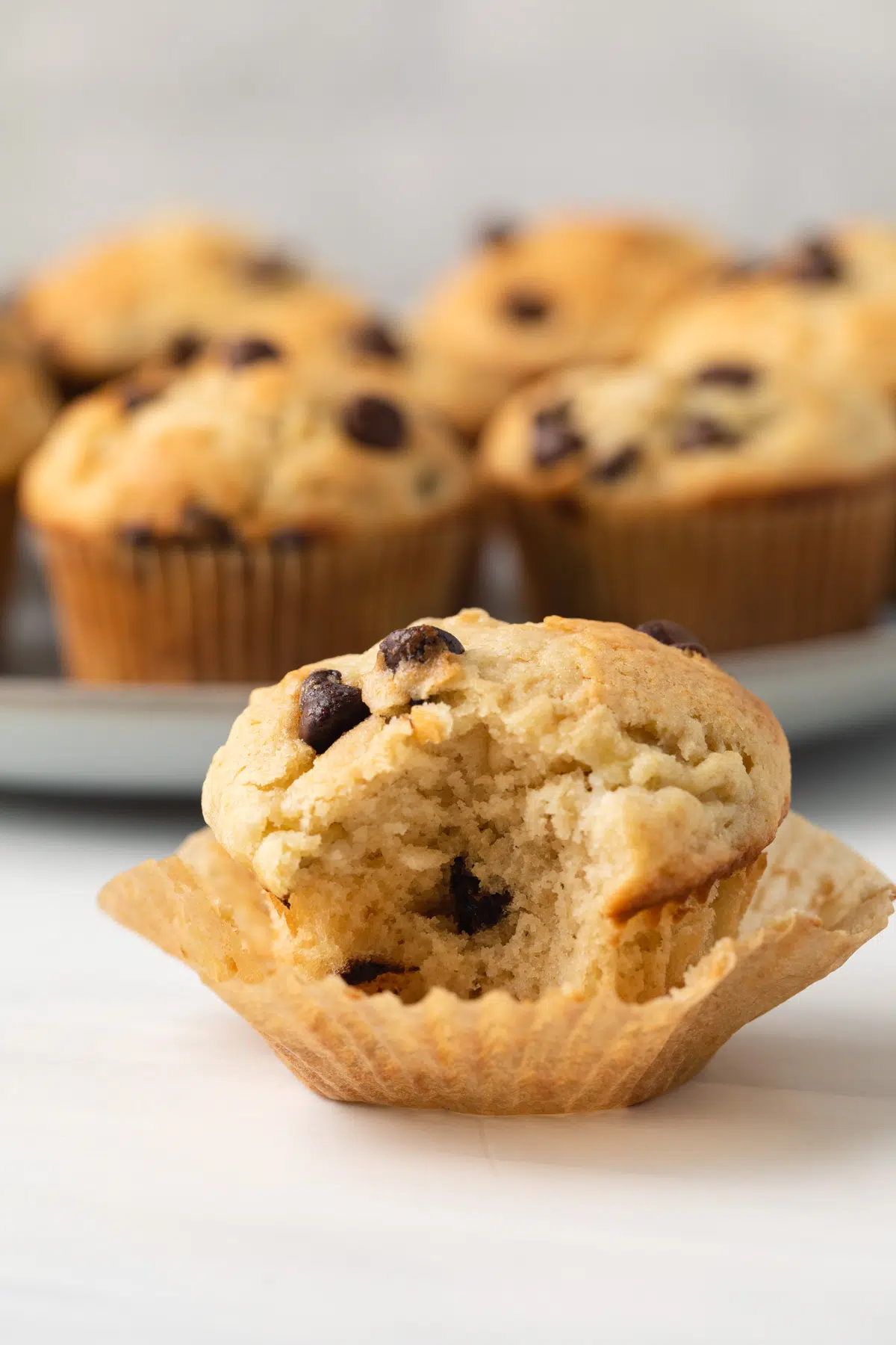 Banana chocolate chip muffin with bite taken out.