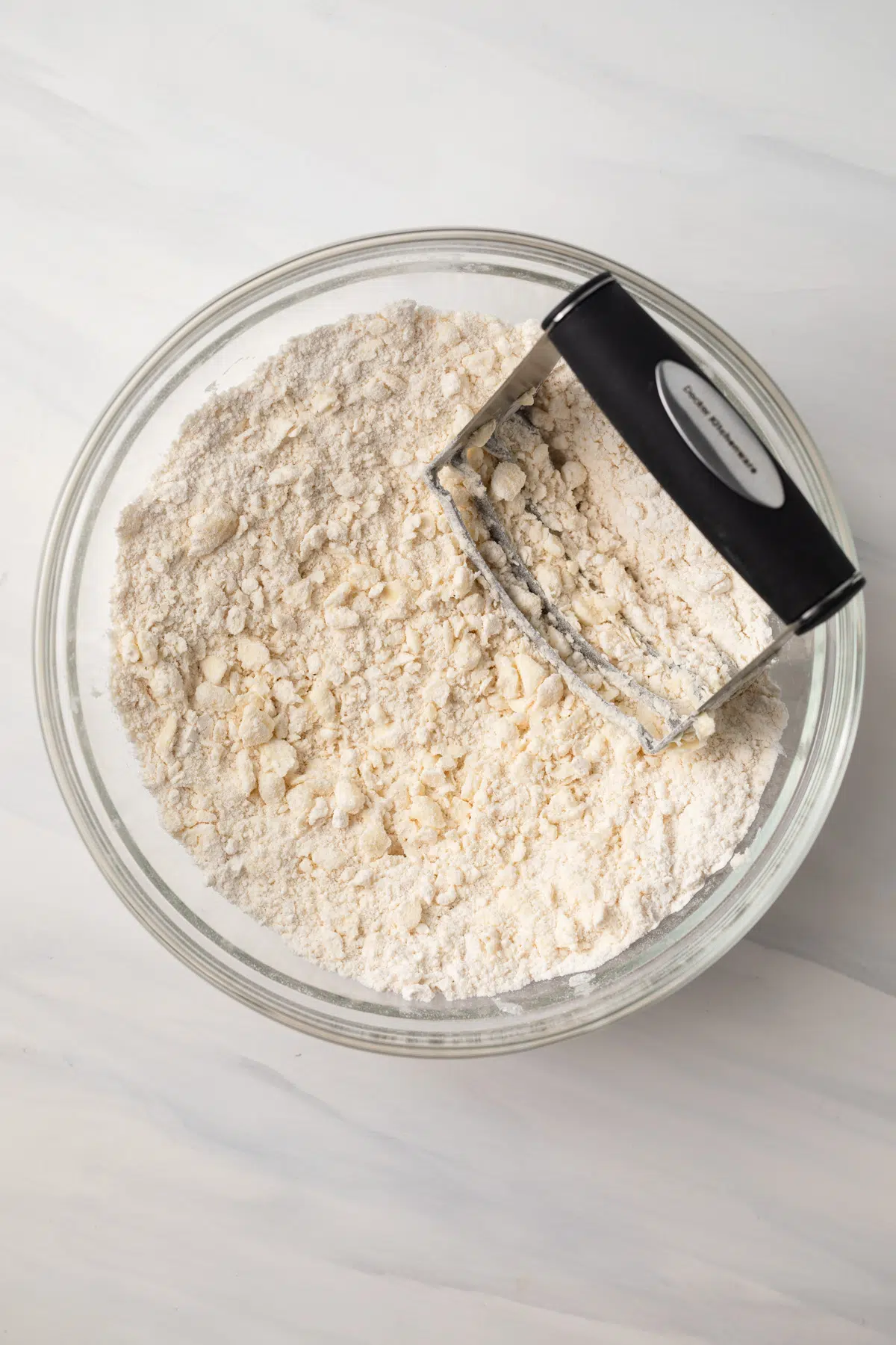 Butter cut into flour with pastry blender.