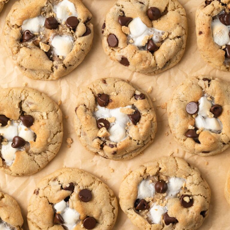Overhead of s'mores cookies on brown parchment paper.