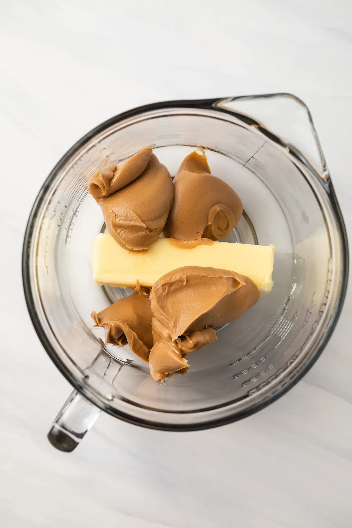 Butter and peanut butter in large mixing bowl.