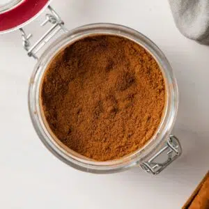 Homemade pumpkin pie spice in a glass jar.