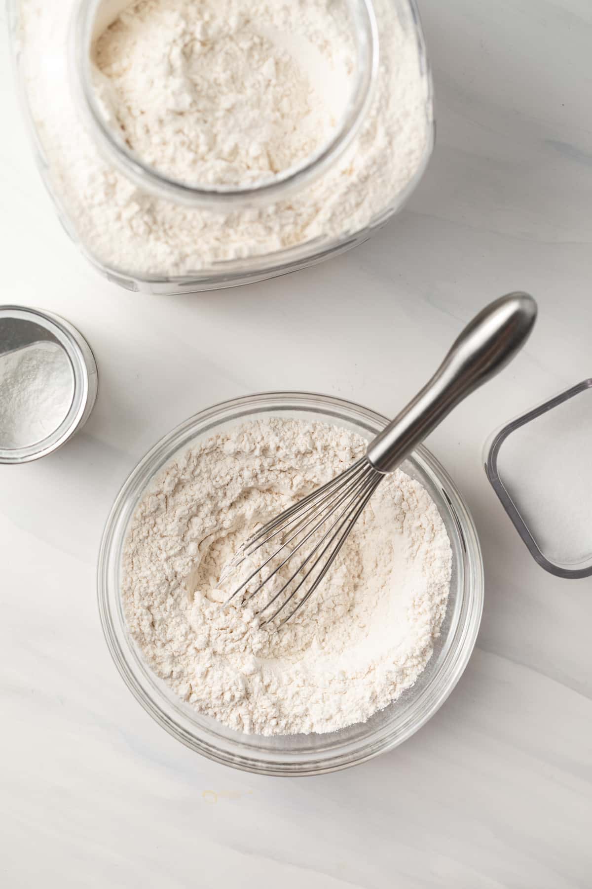 Self raising flour whisked in a bowl.