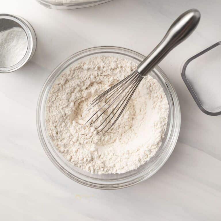 Self raising flour whisked in a bowl.