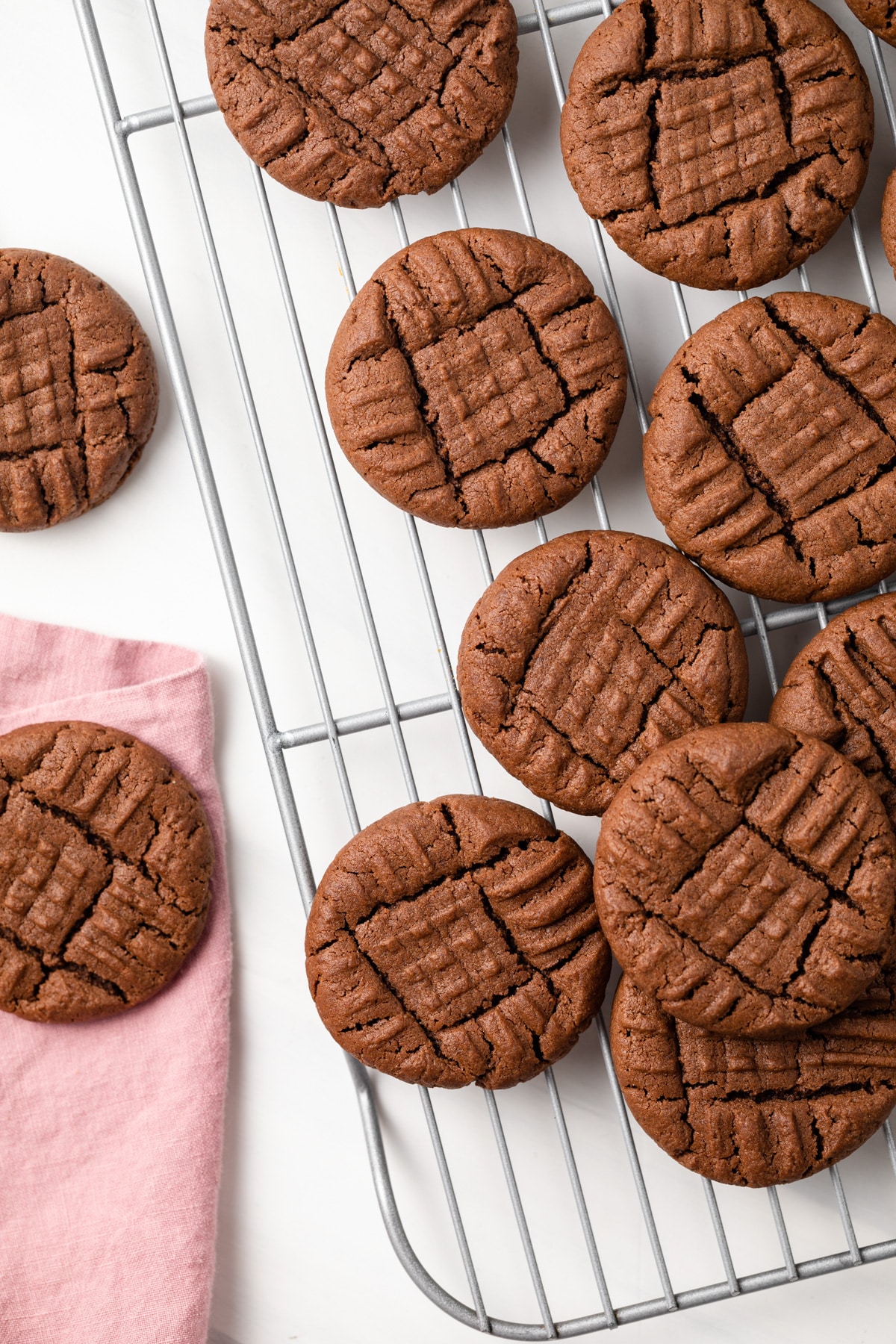 Chocolate peanut butter cookies on a wire rack,