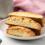 Almond biscotti stacked on plate.