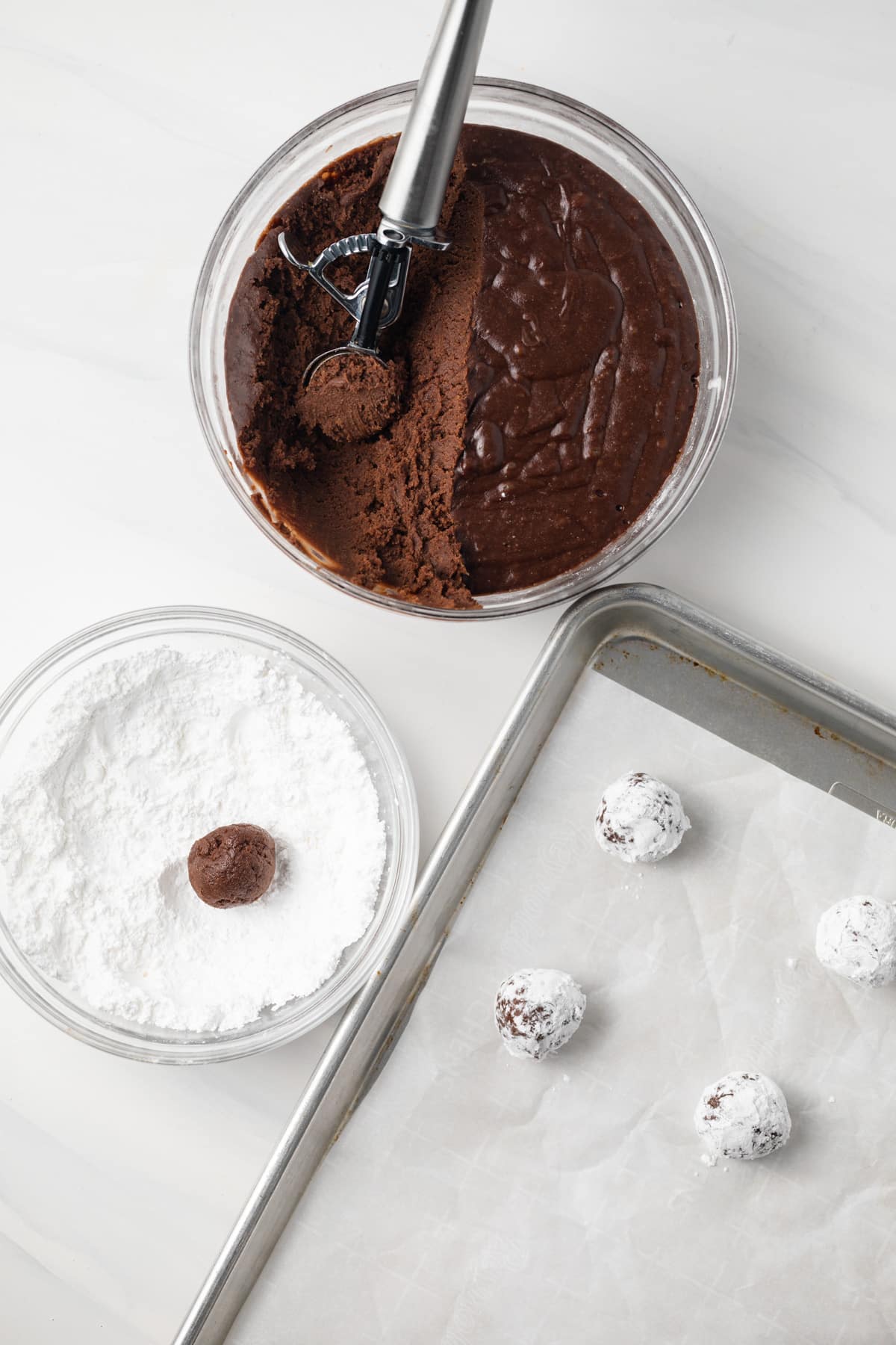 Chocolate cookie dough rolled in powdered sugar.