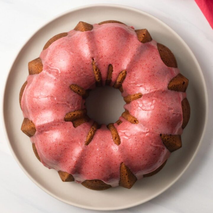 Overhead view of strawberry pound cake on cake plate.