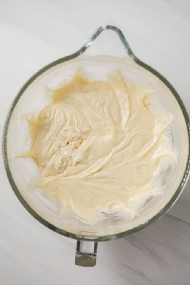 Wet ingredients for vanilla cake mixed in glass bowl.