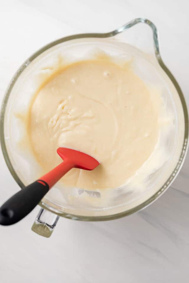 Cake batter in glass mixing bowl.