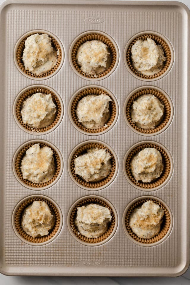 Unbaked muffin batter in muffin pan.