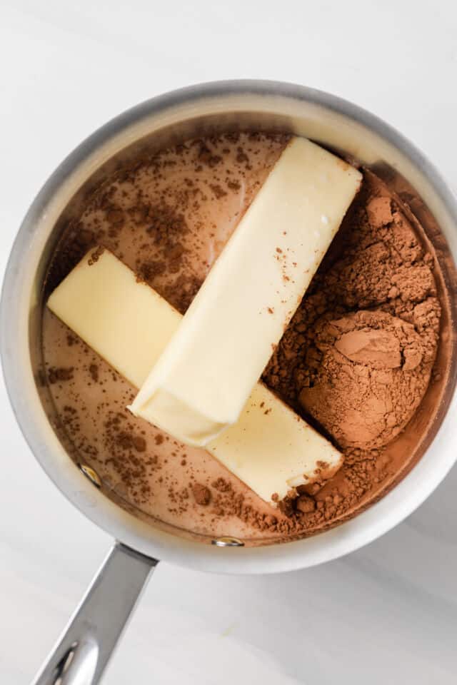 Butter, milk, and cocoa powder in saucepan.