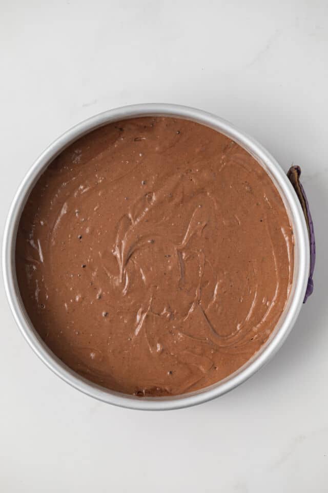 Chocolate cake batter in cake pan.