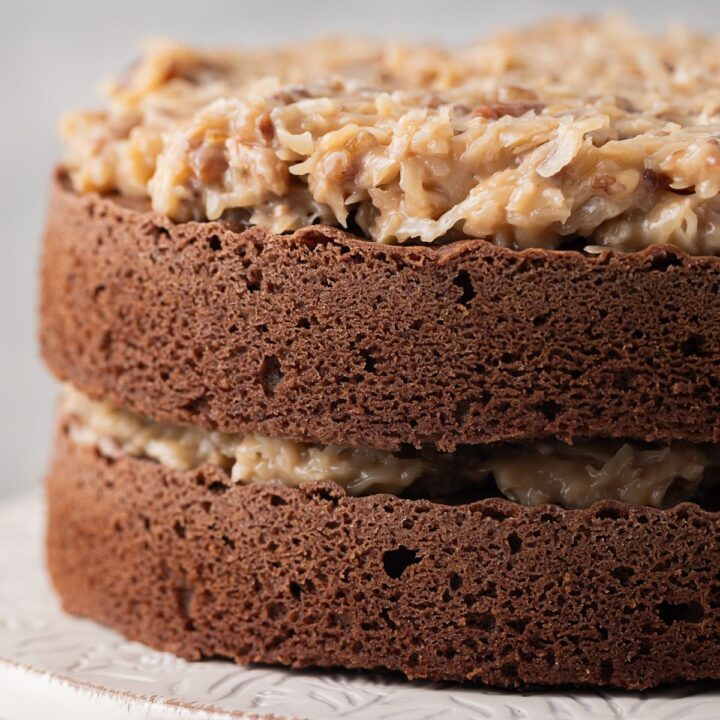 Layers of chocolate cake topped with German chocolate cake frosting.