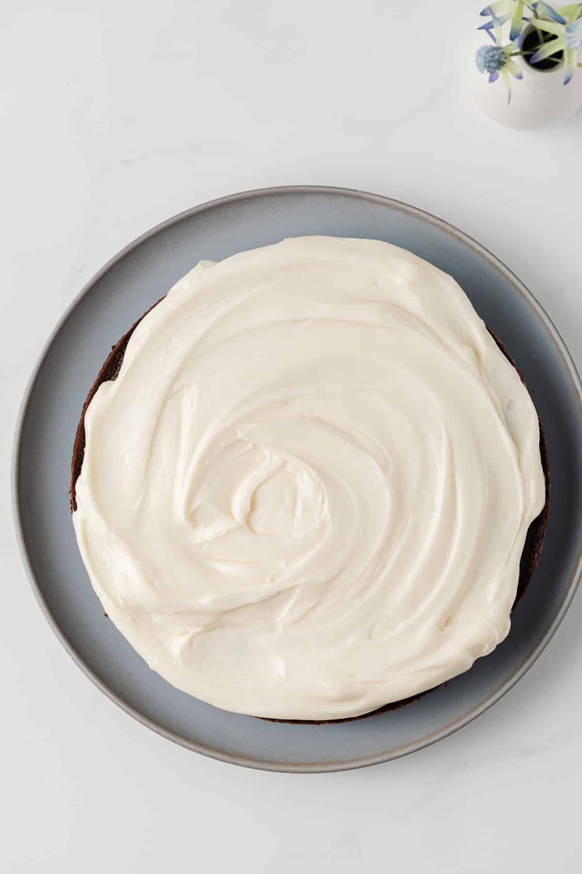 Overhead of gingerbread cake with cream cheese frosting