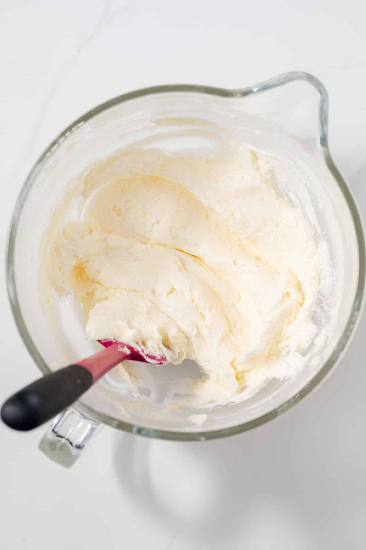 Lemon frosting in a glass bowl.