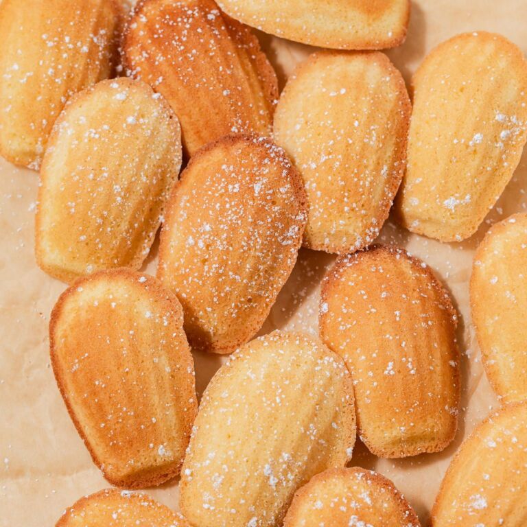 Madeleines dusted with powdered sugar.