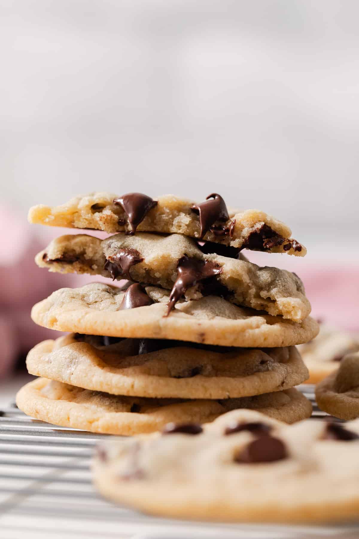 A stack of melty chocolate chip cookies made without eggs.
